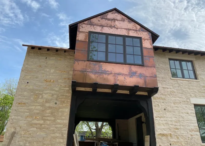 Copper metal panel facade on a stone building for Skylight Installation in Wheeling